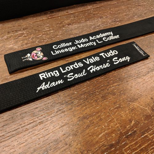 Embroidered Transition Black Belt White Stitching